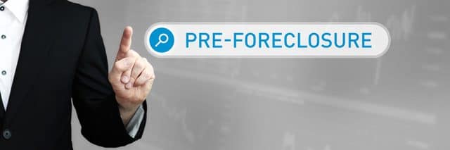 Pre-Foreclosure. Man in a suit points a finger at a search box.